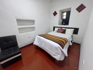 Postel nebo postele na pokoji v ubytování Mallku Wasi - Lodging Hotel Cusco