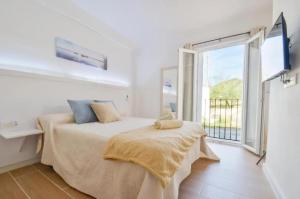 a bedroom with a bed and a large window at Elegant House with Pool in Alcaudete in Sabariego +36 photos