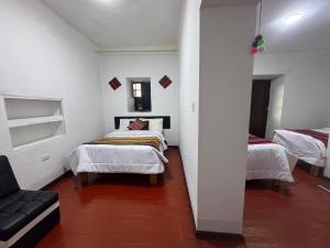 Postel nebo postele na pokoji v ubytování Mallku Wasi - Lodging Hotel Cusco
