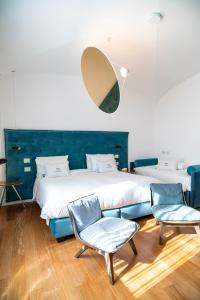 Postel nebo postele na pokoji v ubytování Palazzo Martinelli + 37 fotografií