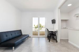 TV a/nebo společenská místnost v ubytování Alcudia Apartments