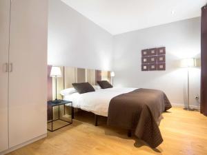 Posteľ alebo postele v izbe v ubytovaní Rent Top Apartments Rambla Catalunya