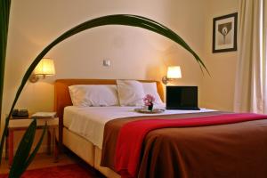 Postel nebo postele na pokoji v ubytování Semeli Hotel
