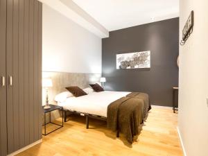 Posteľ alebo postele v izbe v ubytovaní Rent Top Apartments Rambla Catalunya