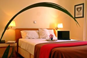 Postel nebo postele na pokoji v ubytování Semeli Hotel
