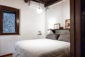 Ένα ή περισσότερα κρεβάτια σε δωμάτιο στο Alle Scalette - Casa Vacanze