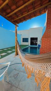 Bazén v ubytování Casa Ampla com Piscina e Área de Churrasco 400A nebo v jeho okolí