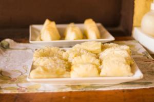 three trays of food sitting on a table at Raiz Kite Cabana in Jericoacoara +85 photos