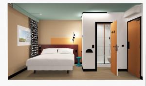 Postel nebo postele na pokoji v ubytování Unisotel