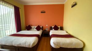 Postel nebo postele na pokoji v ubytování Hotel Nagarkot Inn