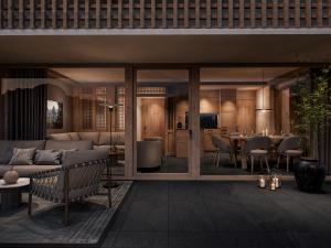 a living room with a couch and a table at Sandhof Apartments in Lech am Arlberg