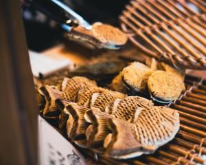 a bunch of bread sitting on a grill at Guest House coco-Rin in Hamamatsu +32 photos