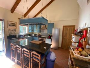 a kitchen with a island in the middle of it at La Cheneraie in Artignosc-sur-Verdon