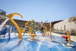 a group of children playing in a water park at Occidental Jandía Mar in Morro del Jable