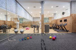a gym with exercise equipment and balls on the floor at Occidental Jandía Mar in Morro del Jable