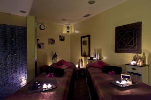 a living room with two couches and two tables at Occidental Jandía Mar in Morro del Jable