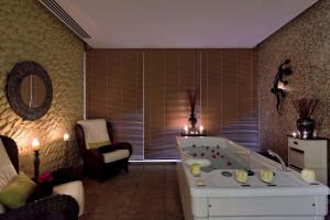 a large bathroom with a tub in a room at Occidental Jandía Mar in Morro del Jable