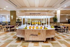 a buffet in a restaurant with fruit on a table at Occidental Jandía Mar in Morro del Jable
