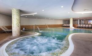 a large swimming pool in a hotel room at Occidental Jandía Mar in Morro del Jable