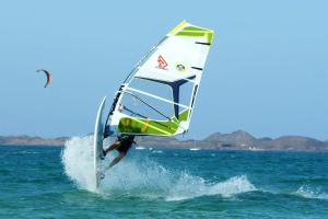 a man riding a wind sail on the ocean at Occidental Jandía Mar in Morro del Jable