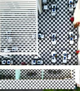 a rendering of a checkered wall with toilets at The Oscar Olympic Hotel in Thessaloniki
