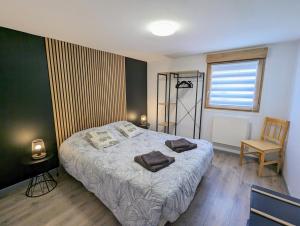 Posteľ alebo postele v izbe v ubytovaní Charmant appartement à Gérardmer