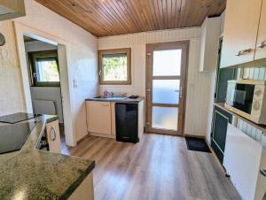Kuchyňa alebo kuchynka v ubytovaní Charmant appartement à Gérardmer