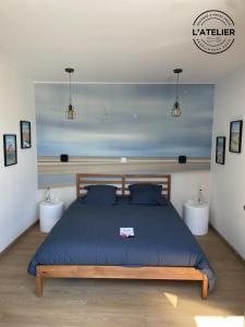 Postel nebo postele na pokoji v ubytování L'Atelier