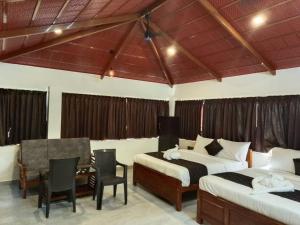 Voodi või voodid majutusasutuse Rv Resorts Yercaud toas