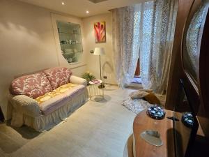 a living room with a couch and a table at Da Caterina alla piccola cascata in Antrodoco