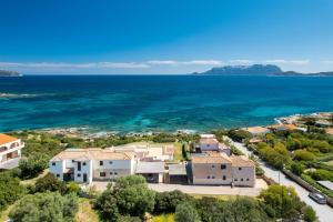 an aerial view of a house with the ocean at Bellosguardo 3, 8 - Klodge in Olbia