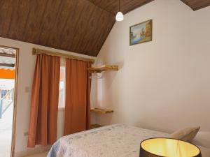 Postel nebo postele na pokoji v ubytování Hostal Familiar Rolo