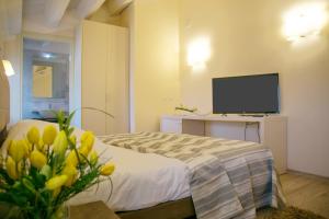 TV a/nebo společenská místnost v ubytování Hotel Calinferno