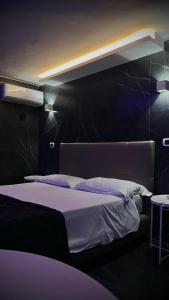 Postel nebo postele na pokoji v ubytování hotel glem