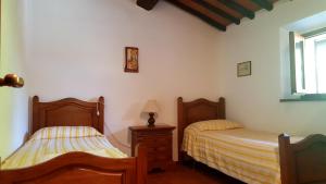 Postel nebo postele na pokoji v ubytování Holiday House Le Selvole