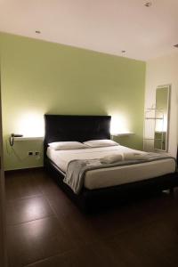 Postel nebo postele na pokoji v ubytování hotel glem