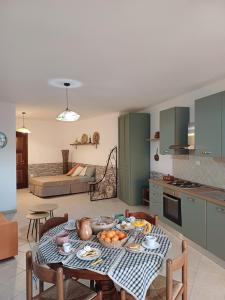 a kitchen with a table with food on it at Tinnari home in Cascabraga