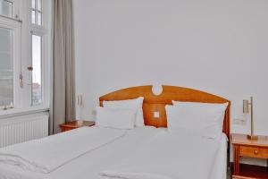 Postel nebo postele na pokoji v ubytování Seehotel Borkum