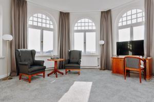 TV a/nebo společenská místnost v ubytování Seehotel Borkum
