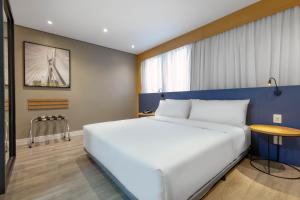 Cama ou camas em um quarto em Holiday Inn Sao Paulo Parque Anhembi by IHG