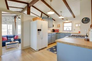 a kitchen with a white refrigerator in a room at Steps to Beaches and Main Street Hyannis Retreat in Hyannis +24 photos