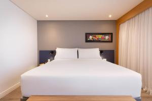 Cama ou camas em um quarto em Holiday Inn Sao Paulo Parque Anhembi by IHG