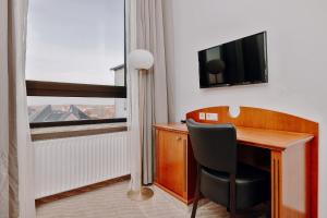 TV a/nebo společenská místnost v ubytování Seehotel Borkum