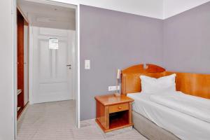 Postel nebo postele na pokoji v ubytování Seehotel Borkum