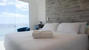 Postel nebo postele na pokoji v ubytování One Love Motel