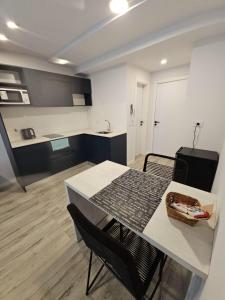 a kitchen and dining room with a table and chairs at Alquiler Temporario Rosario 23 in Rosario +6 photos