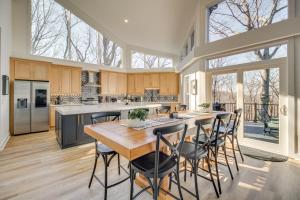 a large kitchen with a wooden table and chairs at 3 Mi to Winery Jasper Mountain Chalet with Hot Tub! in Jasper