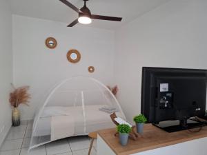 Postel nebo postele na pokoji v ubytování Le Refuge du Colibri