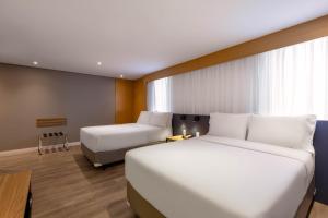 Cama ou camas em um quarto em Holiday Inn Sao Paulo Parque Anhembi by IHG