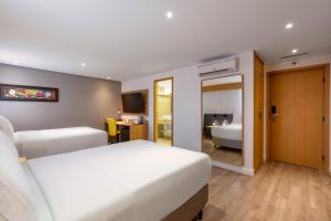 Cama ou camas em um quarto em Holiday Inn Sao Paulo Parque Anhembi by IHG